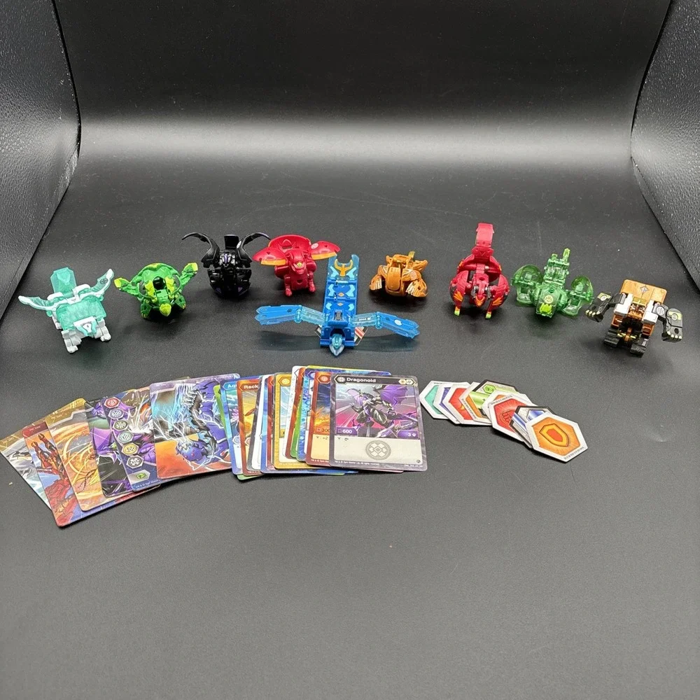 Lot Of 9 Bakugan Figures And 23 Bakugan Cards/Metal Card